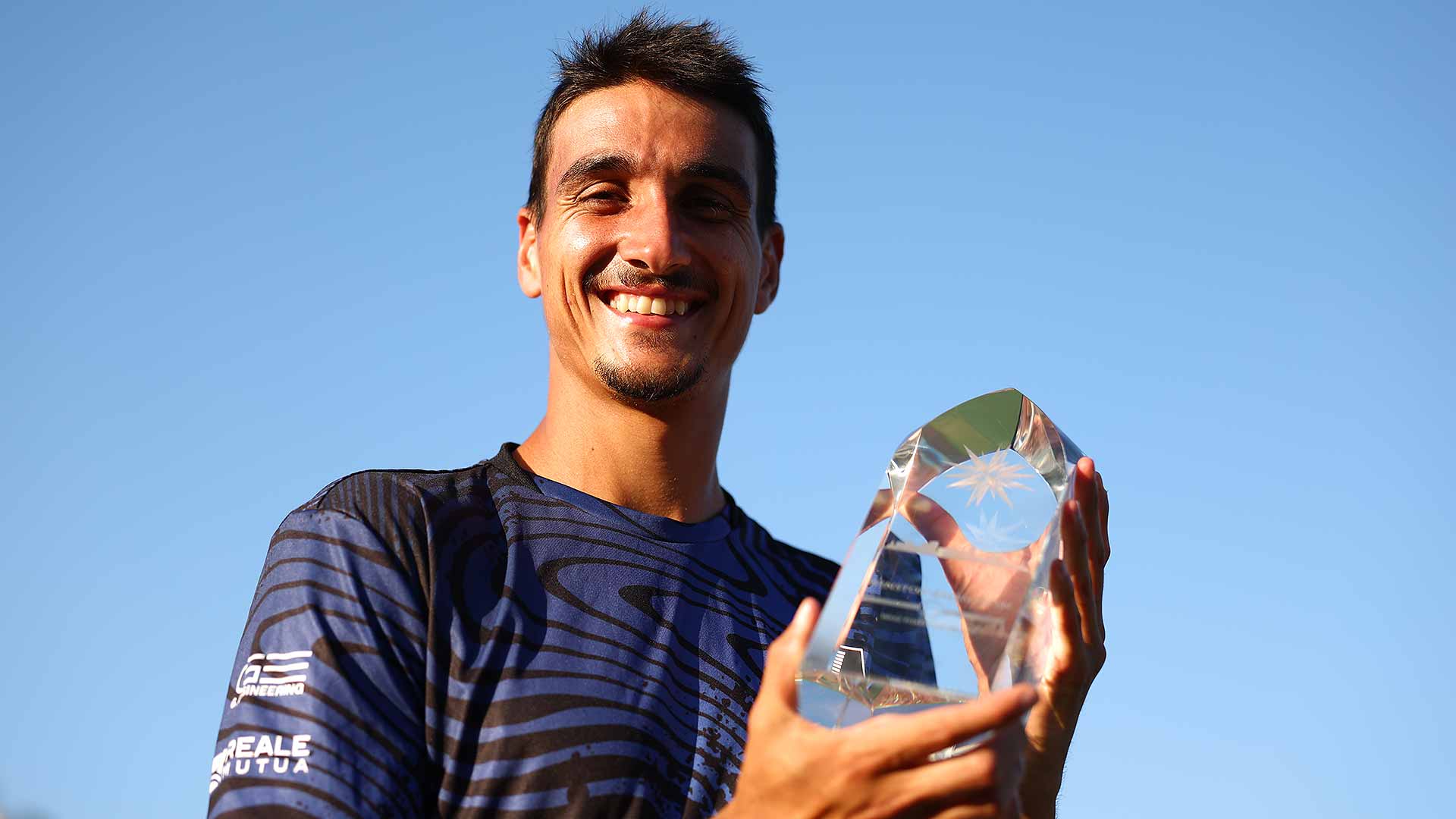 Lorenzo Sonego celebrates his fourth ATP Tour title.