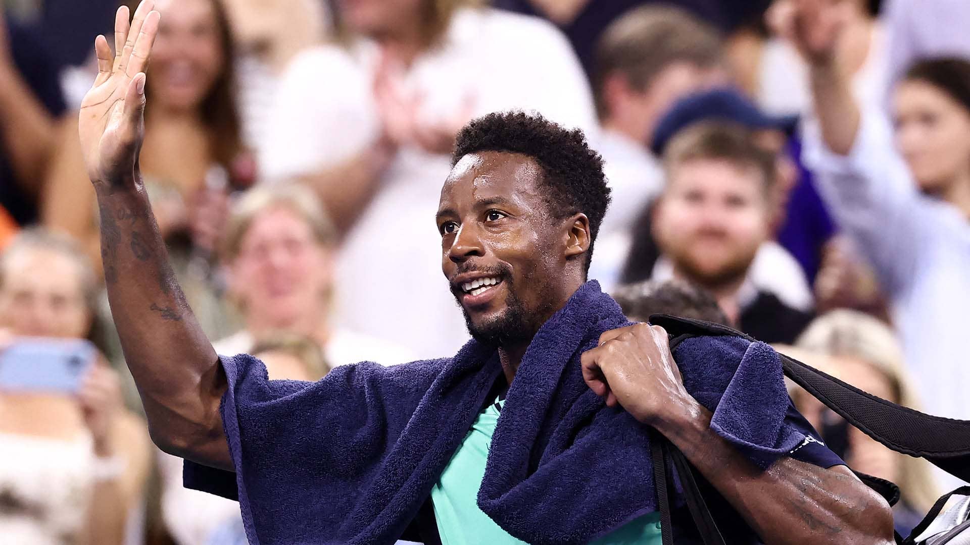 Gael Monfils waves goodbye after playing his final US Open match Thursday.
